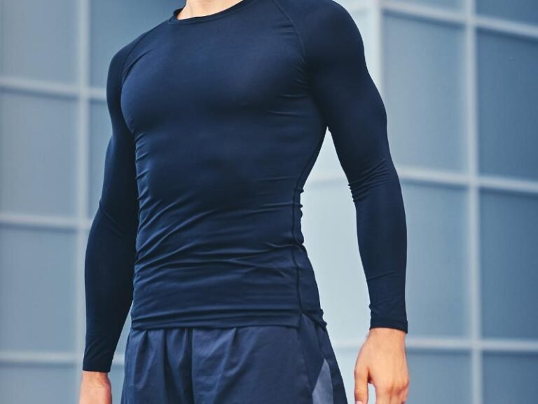 Man wearing a navy long-sleeve compression sports shirt